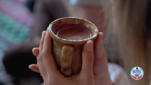 Mug of Ceremonial Grade cacao in a woman's hands